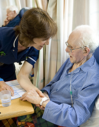 nurse checking wrist band 