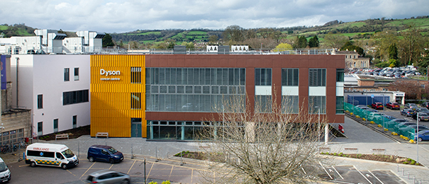 An aerial shot of the exterior of the Dyson Cancer Centre showing the parking bays at the front