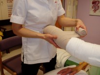 patients arm being bandaged