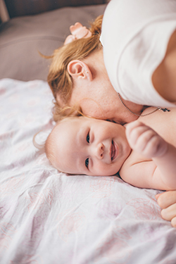 Mother and smiling baby