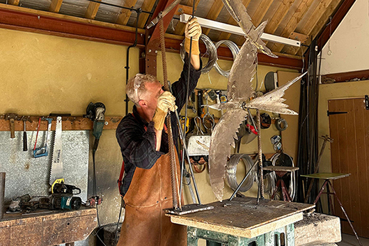 Hamish Mackie working on the sculpture entitled Swifts